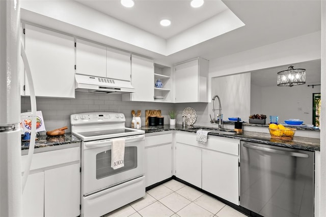 2650 Countryside Blvd Unit B102, Clearwater, FL 33761 - kitchen featuring under cabinet range hood, a sink, white cabinetry, open shelves, and appliances with stainless steel finishes
