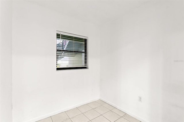 2650 Countryside Blvd Unit B102, Clearwater, FL 33761 - unfurnished room featuring baseboards and light tile patterned floors
