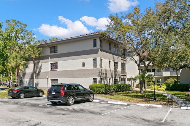 2650 Countryside Blvd Unit B102, Clearwater, FL 33761 - view of property with uncovered parking