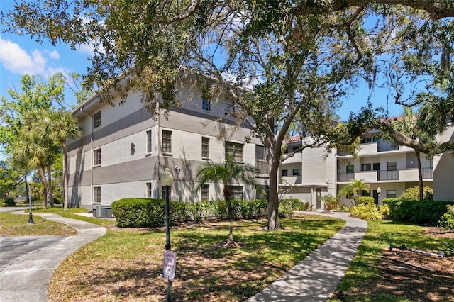 2650 Countryside Blvd Unit B102, Clearwater, FL 33761 - view of property featuring central air condition unit