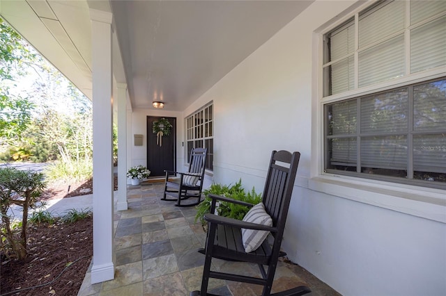 view of patio featuring a porch