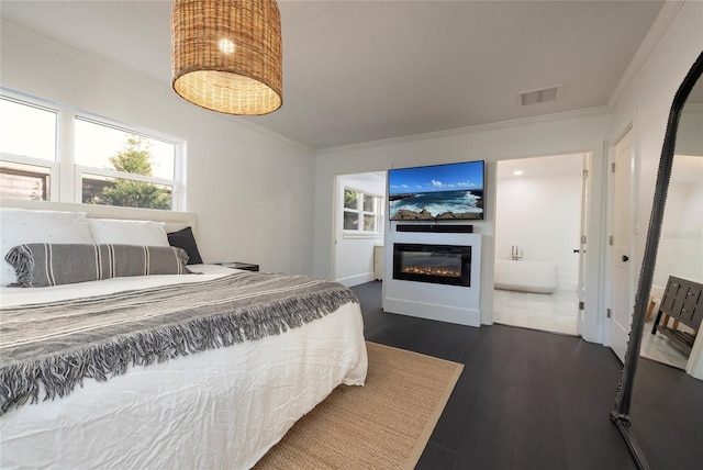 bedroom with crown molding, visible vents, and dark wood-style floors