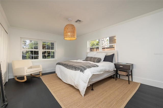 bedroom featuring baseboards, visible vents, ornamental molding, and wood finished floors