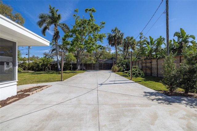 exterior space with a yard and fence