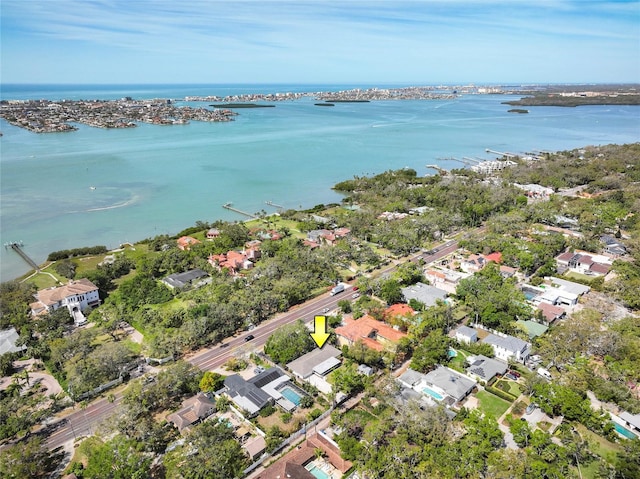 drone / aerial view featuring a water view and a residential view
