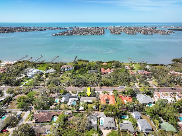 bird's eye view featuring a water view and a residential view
