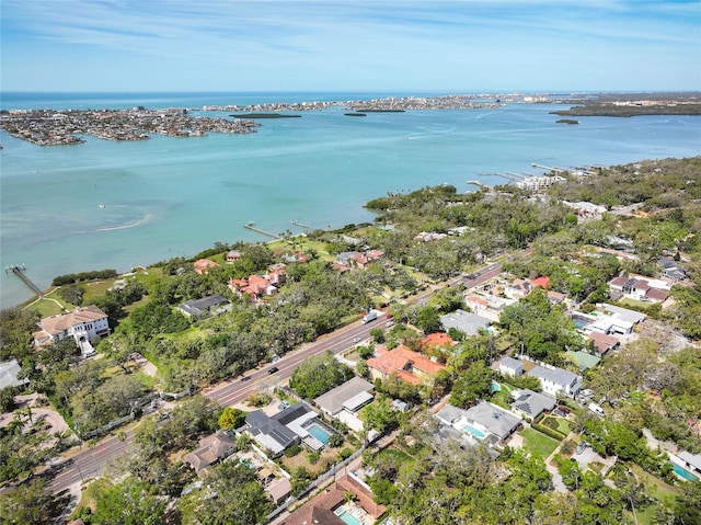 birds eye view of property with a residential view and a water view