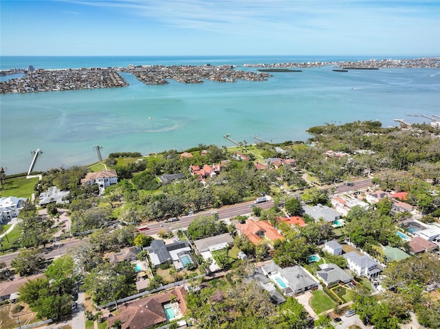 drone / aerial view with a water view and a residential view