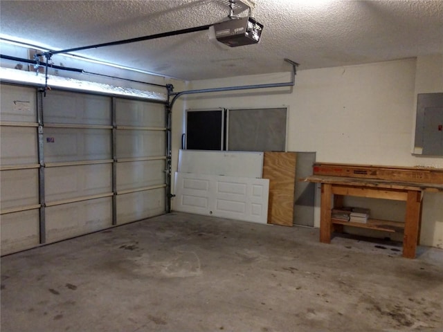 garage featuring electric panel and a garage door opener