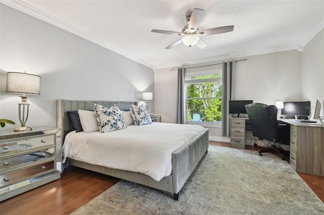 bedroom featuring crown molding, wood finished floors, and ceiling fan