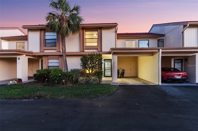 6140 Sun Blvd Unit 7, Saint Petersburg, FL 33715 - multi unit property with asphalt driveway and an attached carport