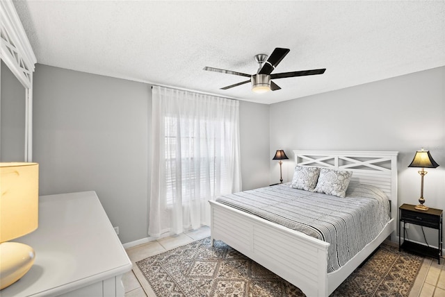 6140 Sun Blvd Unit 7, Saint Petersburg, FL 33715 - tiled bedroom with a textured ceiling and a ceiling fan