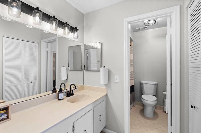 6140 Sun Blvd Unit 7, Saint Petersburg, FL 33715 - bathroom with a closet, vanity, and tile patterned flooring