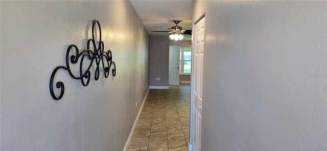 5725 80th St N Unit 107, Saint Petersburg, FL 33709 - hall featuring baseboards and light marble finish flooring
