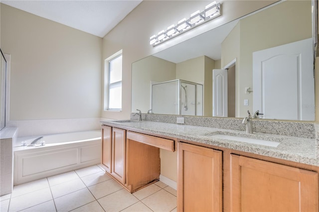 full bathroom with a sink, double vanity, a shower stall, and tile patterned flooring