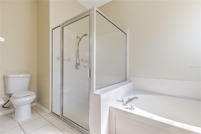 full bathroom with tile patterned floors, a shower stall, toilet, and a bath