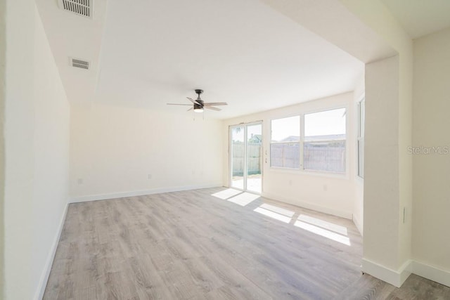 7322 Mako Dr, Hudson, FL 34667 - spare room featuring a ceiling fan, baseboards, light wood finished floors, and visible vents