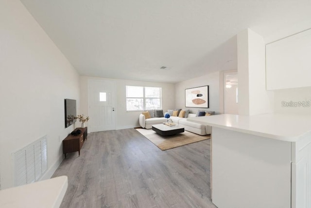 7322 Mako Dr, Hudson, FL 34667 - living area with visible vents and light wood finished floors