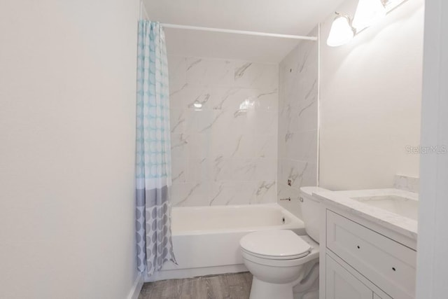 7322 Mako Dr, Hudson, FL 34667 - full bath with shower / bath combo, toilet, vanity, and wood finished floors