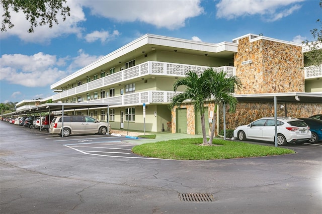 4885 1st St NE Unit 305, Saint Petersburg, FL 33703 - view of property featuring covered parking