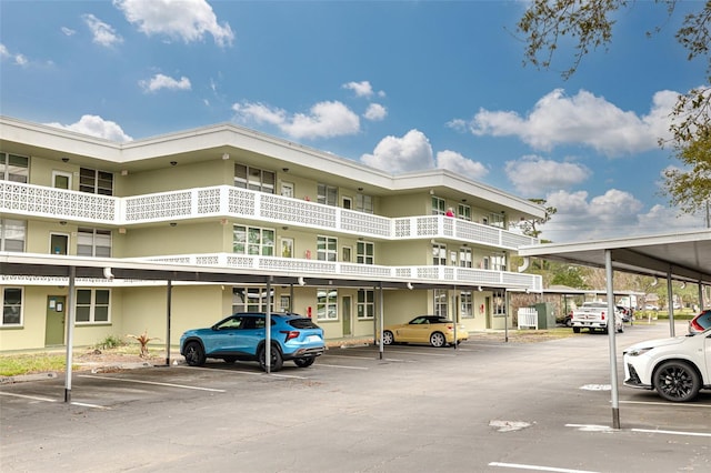 4885 1st St NE Unit 305, Saint Petersburg, FL 33703 - view of building exterior featuring covered parking