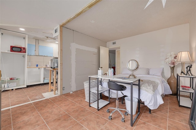 4885 1st St NE Unit 305, Saint Petersburg, FL 33703 - bedroom with light tile patterned floors and visible vents