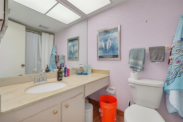 4885 1st St NE Unit 305, Saint Petersburg, FL 33703 - bathroom with visible vents, curtained shower, toilet, and vanity