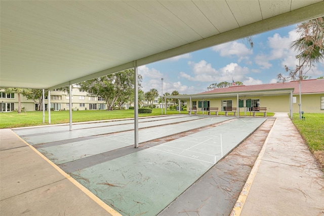 4885 1st St NE Unit 305, Saint Petersburg, FL 33703 - view of home's community featuring a lawn and shuffleboard