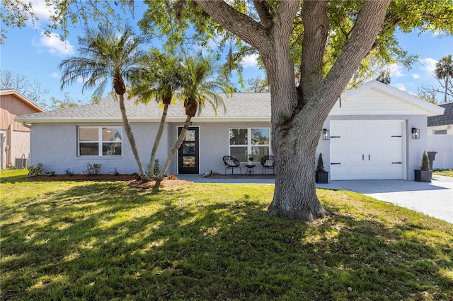 3352 Honeymoon Ln, Holiday, FL 34691 - single story home featuring an attached garage, a front lawn, central air condition unit, roof with shingles, and driveway