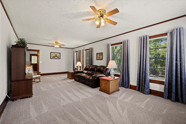 living room featuring light carpet, ceiling fan, and ornamental molding