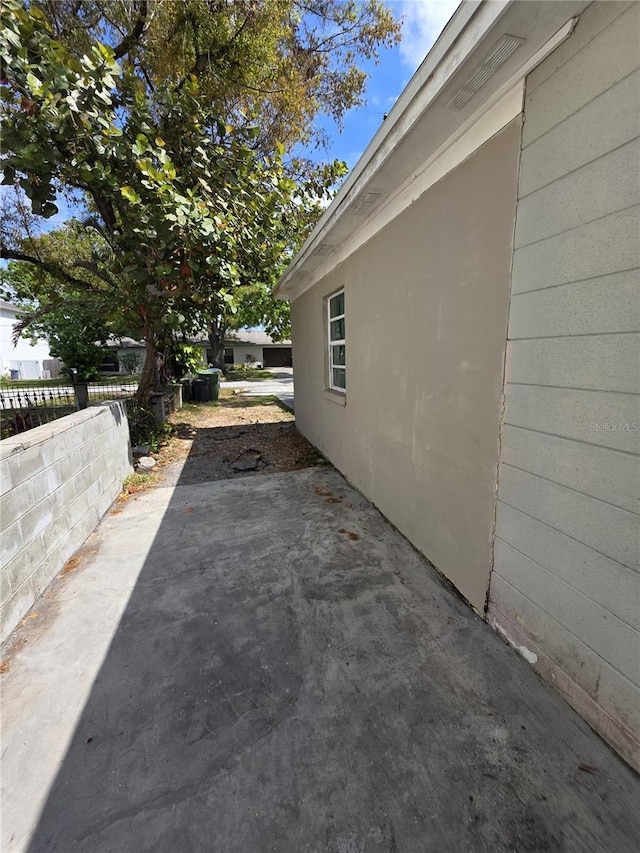 view of patio featuring fence