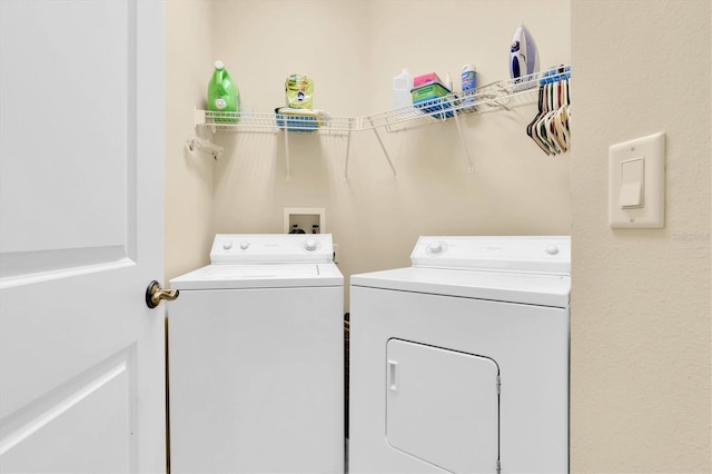 laundry room featuring washer and dryer and laundry area