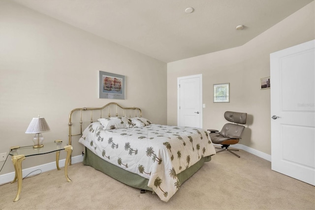 carpeted bedroom featuring baseboards