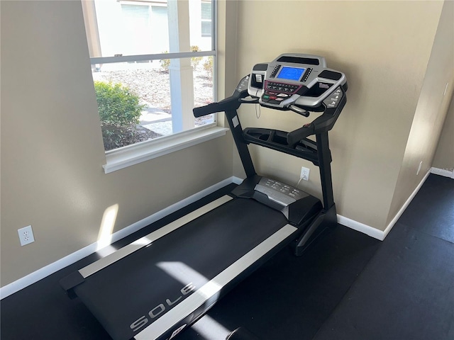 exercise room with baseboards