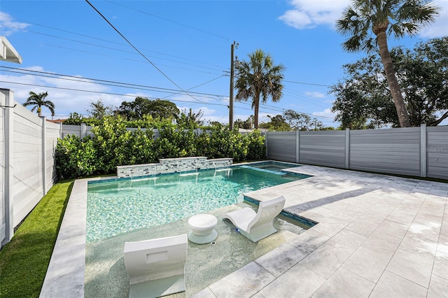 view of swimming pool with a hot tub, a fenced in pool, a fenced backyard, and a patio area