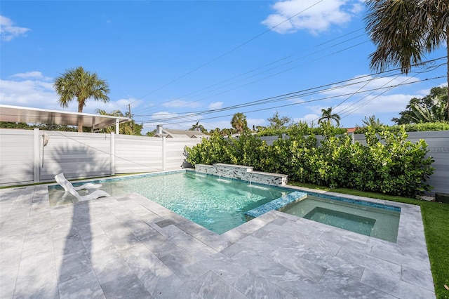 view of swimming pool with a patio, a pool with connected hot tub, and a fenced backyard