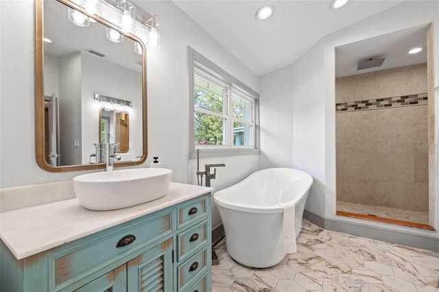 full bathroom featuring a tile shower, recessed lighting, marble finish floor, visible vents, and a freestanding bath