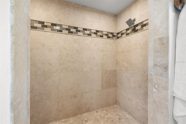 bathroom with a tile shower