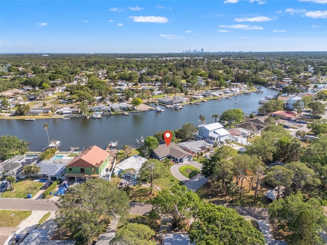 birds eye view of property featuring a water view and a residential view