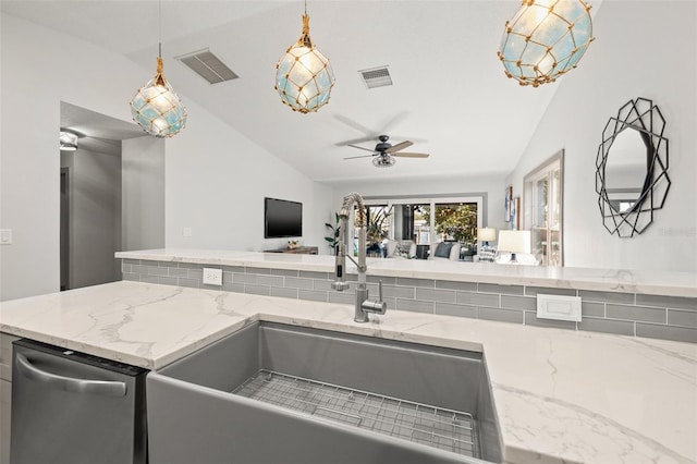 kitchen featuring open floor plan, stainless steel dishwasher, lofted ceiling, and visible vents