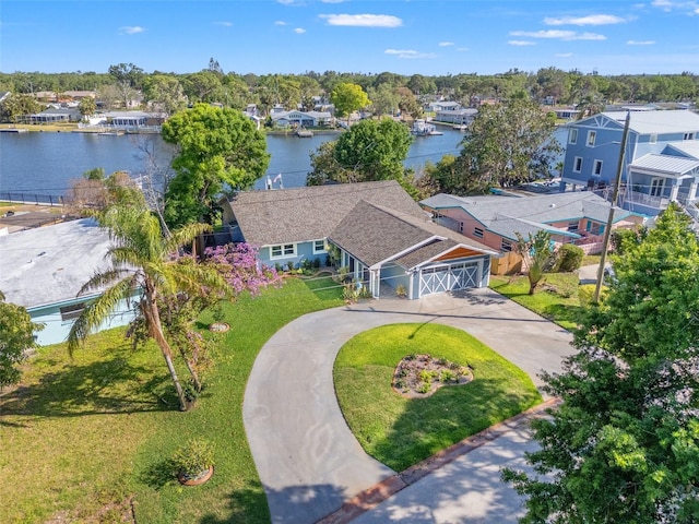 birds eye view of property featuring a residential view and a water view