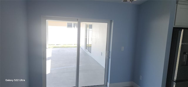 doorway featuring baseboards and visible vents