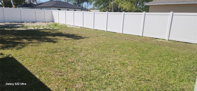 view of yard featuring fence