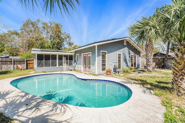 1366 Wexford Dr N, Palm Harbor, FL 34683 - view of pool with a fenced backyard, a fenced in pool, and a sunroom