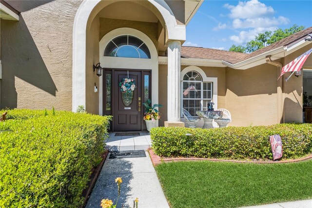 3627 Cypress Meadows Rd, Tampa, FL 33624 - view of exterior entry with stucco siding