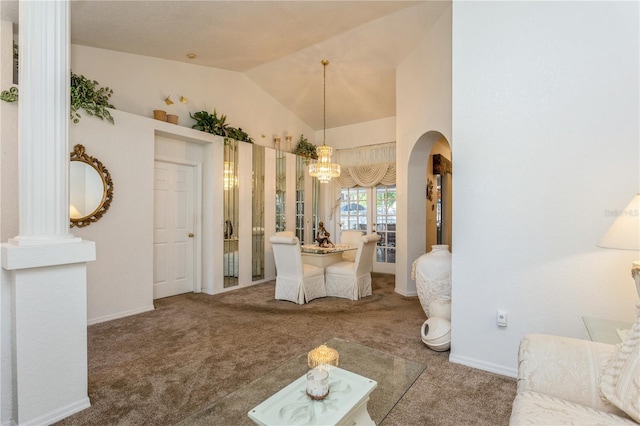 3627 Cypress Meadows Rd, Tampa, FL 33624 - carpeted dining space featuring baseboards, vaulted ceiling, arched walkways, and a chandelier