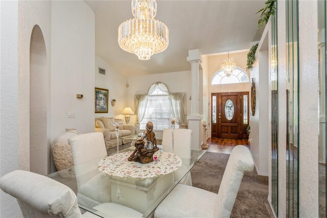 3627 Cypress Meadows Rd, Tampa, FL 33624 - dining space with arched walkways, high vaulted ceiling, visible vents, and an inviting chandelier