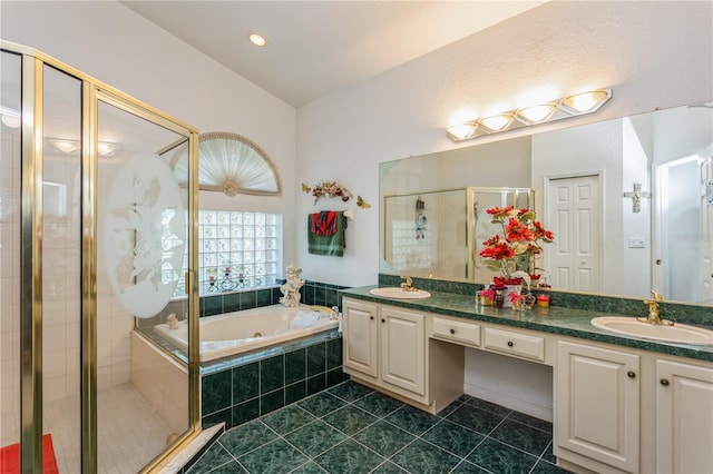 3627 Cypress Meadows Rd, Tampa, FL 33624 - bathroom with a bath, a sink, tile patterned floors, and a stall shower