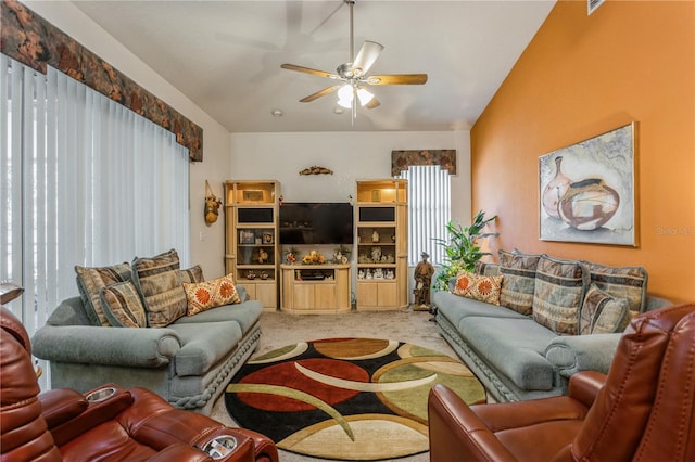 3627 Cypress Meadows Rd, Tampa, FL 33624 - living room featuring a healthy amount of sunlight, vaulted ceiling, carpet floors, and a ceiling fan