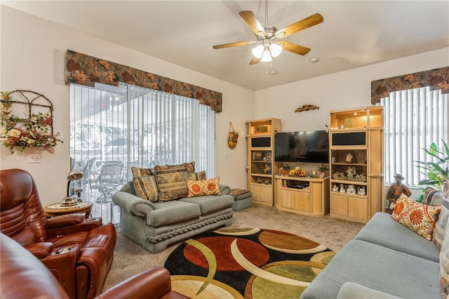 3627 Cypress Meadows Rd, Tampa, FL 33624 - living room featuring a ceiling fan, plenty of natural light, and light carpet